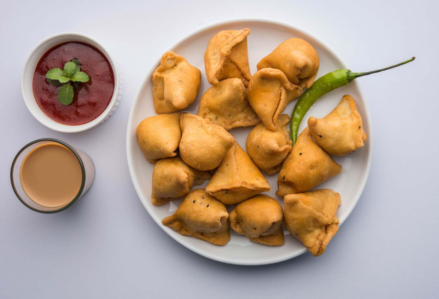 delicious samosas with sauce